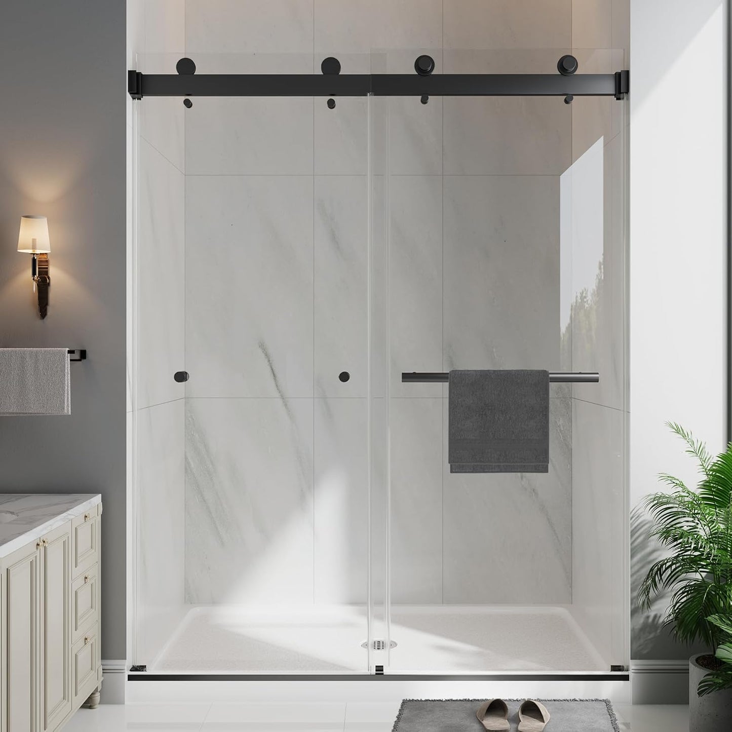 Modern bathroom with a glass shower enclosure, towel rack, and plant.
